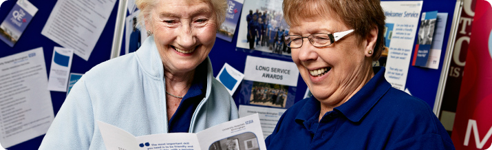 Member of staff speaks to a member of the public